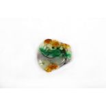 A Chinese multi-coloured jade pendant, carved in deep relief with various vegetation plants, with