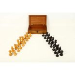 An early 20th Century ebony and boxwood chess set, in complete order, in mahogany box, tallest piece