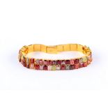 A gem-set bracelet, set with various step-cut gems including garnet, spinel, emerald, amethyst and