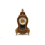 A 19th Century Boule work clock in Louis XVI manner, the gilded clock face set with Roman numerals