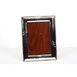 A Continental Sterling silver 925 grade dressing table photograph frame, of plain embossed design,