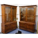Pair of George III design oak bookcases each enclosed by two astragal glazed doors over projecting