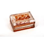 20th century Bohemian amber and clear glass flash cut box and cover with hobnail band decoration.