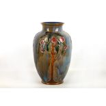 An Art Nouveau Royal Doulton stoneware vase by Maud Bowden, the mottled, tube-lined body decorated