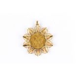 A coin pendant, The Austrian coin, dated 1915, in a radiating star mount