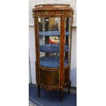 An early 20th Century Louis XV style kingwood vitrine, above glazed door. Applied with gilt brass