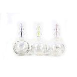 St. Louis France, a set of three crystal glass scent bottles,bearing engraved marks and maker's