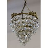 An early 20th Century, gilded metal and Bohemian crystal cut glass shaped drops, hung ceiling