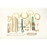 A collection of various mid 20th Century costume jewellery to include brooches, bracelets, necklaces