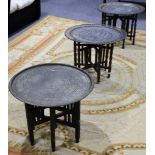 Four Persian engraved tray top tables, 3 with white metal decoration and pierced borders, with 3
