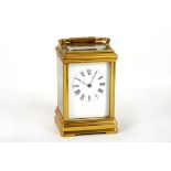 A 20th Century French brass carriage clock, the 8-day repeating movement with rectangular