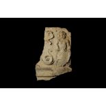 AN ARCHITECTURAL RELIEF DEPICTING A PUTTO HOLDING A SHIELD, PROBABLY TRAVERTINE STONE, 16TH