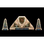 AN ART DECO PERIOD ONYX, GILT BRONZE AND CHAMPLEVE ENAMEL CLOCK GARNITURE IN THE EGYPTIAN TASTE