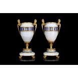 A PAIR OF LATE 19TH CENTURY FRENCH GILT BRONZE, ALGERIAN ONYX AND CHAMPLEVE ENAMELLED URNS IN THE