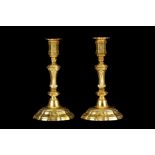 A PAIR OF FRENCH TRANSITIONAL STYLE GILT BRONZE CANDLESTICKS, PROBABLY MID 18TH CENTURY the