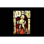 A 16TH / 17TH CENTURY STAINED GLASS PANEL DEPICTING A NOBLEMAN IN ARMOUR the bearded male figure