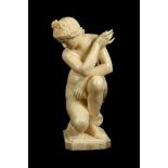 A LARGE 19TH CENTURY ITALIAN CARVED ALABASTER FIGURE OF THE CROUCHING VENUS, AFTER THE ANTIQUE the