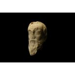 A 13TH CENTURY ITALIAN GOTHIC MARBLE HEAD the male head with long beard and close set eyes, with a