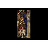 A 19TH CENTURY SWISS STAINED GLASS PANEL DEPICTING A SAINT BESIDE A CATHEDRAL the standing male