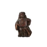 A 17TH / 18TH CENTURY ITALIAN CARVED WALNUT ANGEL SUPPORTING A SHIELD carved with a flat back, the