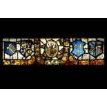 A LARGE 17TH CENTURY AND LATER SWISS STAINED GLASS PANEL centred by an oval 17th century panel