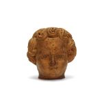 A 17TH CENTURY FLEMISH CARVED WOOD HEAD OF A CHILD his hair carved with scrolling ringlets, with