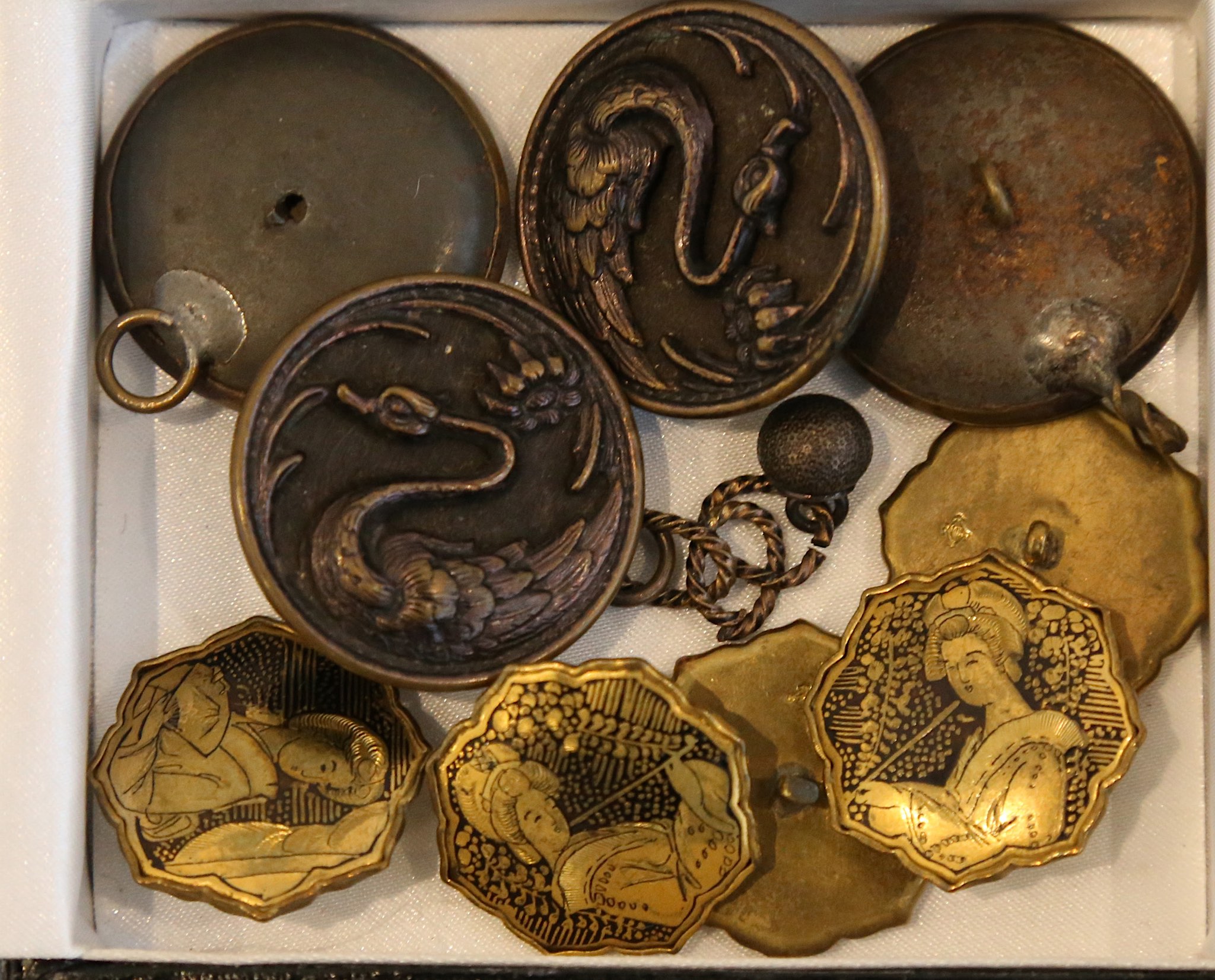 A set of 5 early 20th Century Japanese gilt metal buttons, decorated with female figures, and four