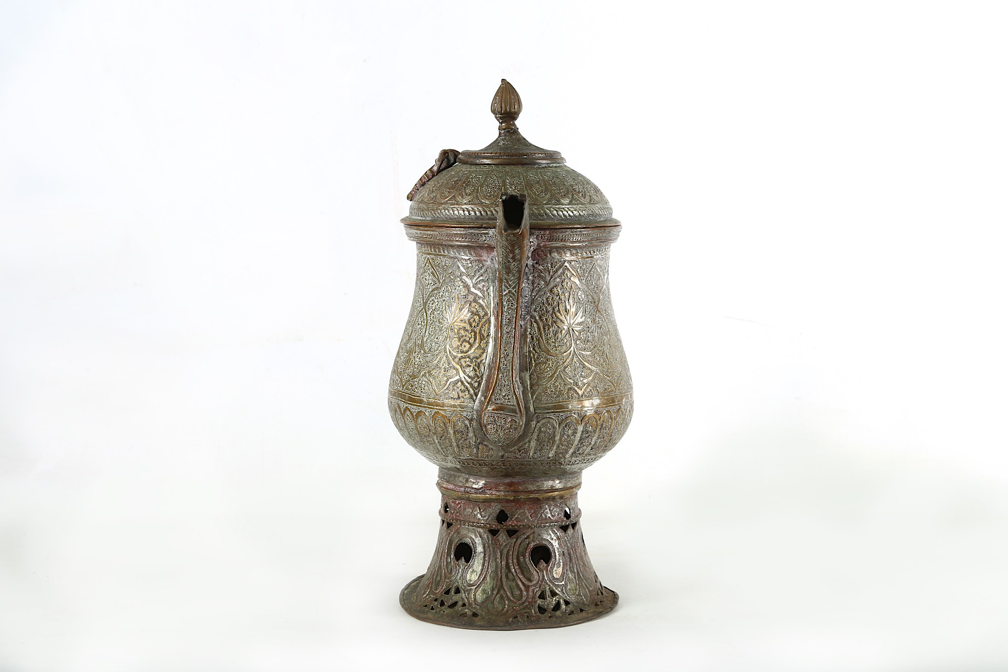 A 19th century Indo/Persian flagon. All over incised design and a pierced base Height 40 cms. - Image 4 of 7