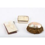 A mother of pearl box with a carved representation of the manger with 3 kings, a nest casket in