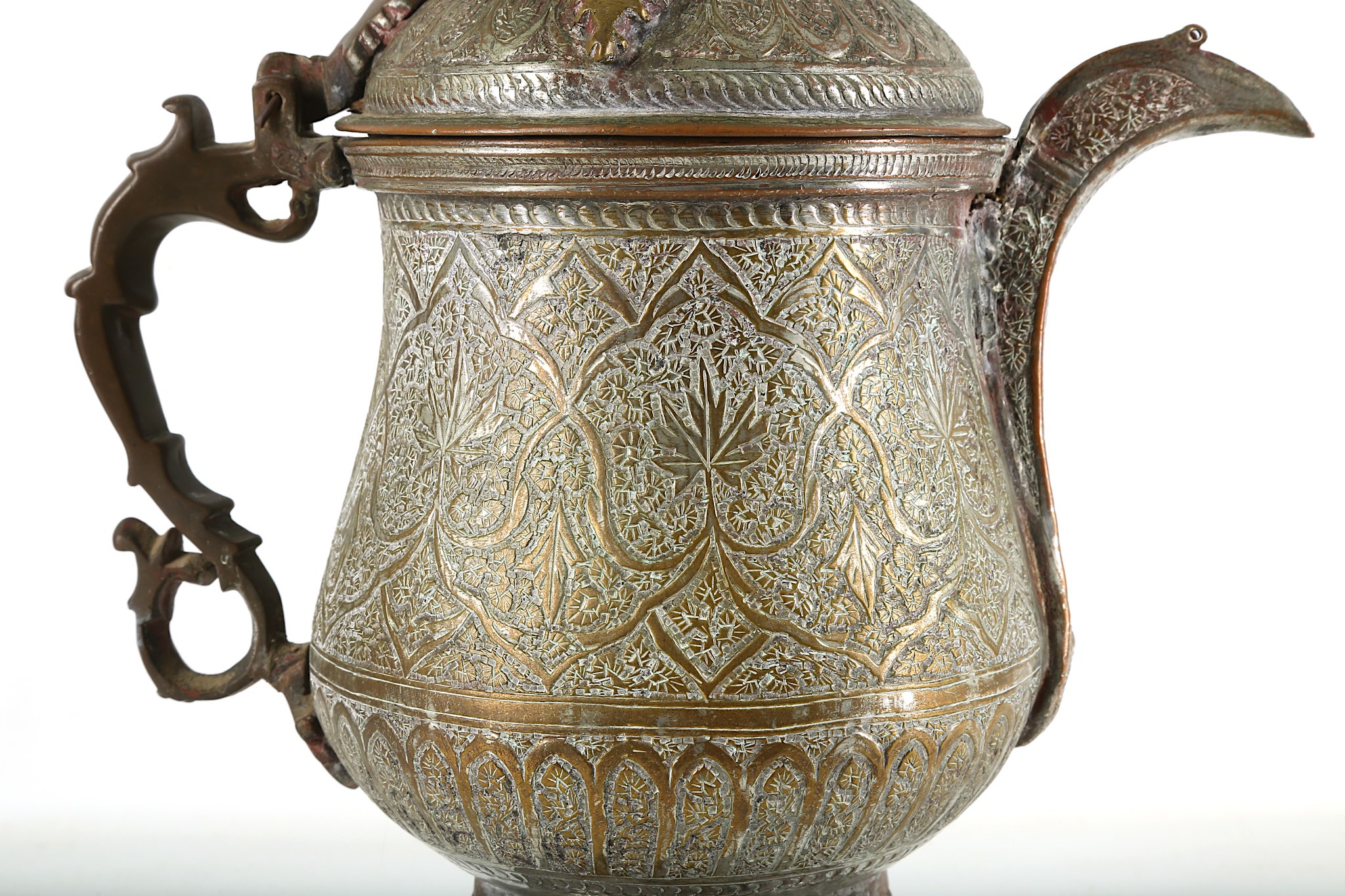 A 19th century Indo/Persian flagon. All over incised design and a pierced base Height 40 cms. - Image 5 of 7