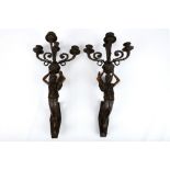 A pair of 20th Century empire style parcel metal gilt wall sconces, four branch candle, the stems