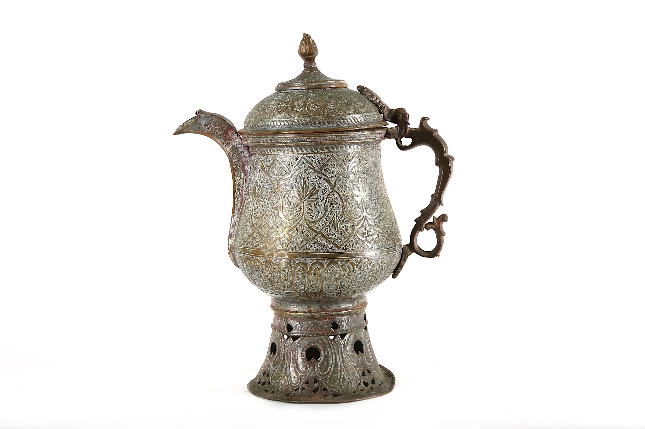A 19th century Indo/Persian flagon. All over incised design and a pierced base Height 40 cms.