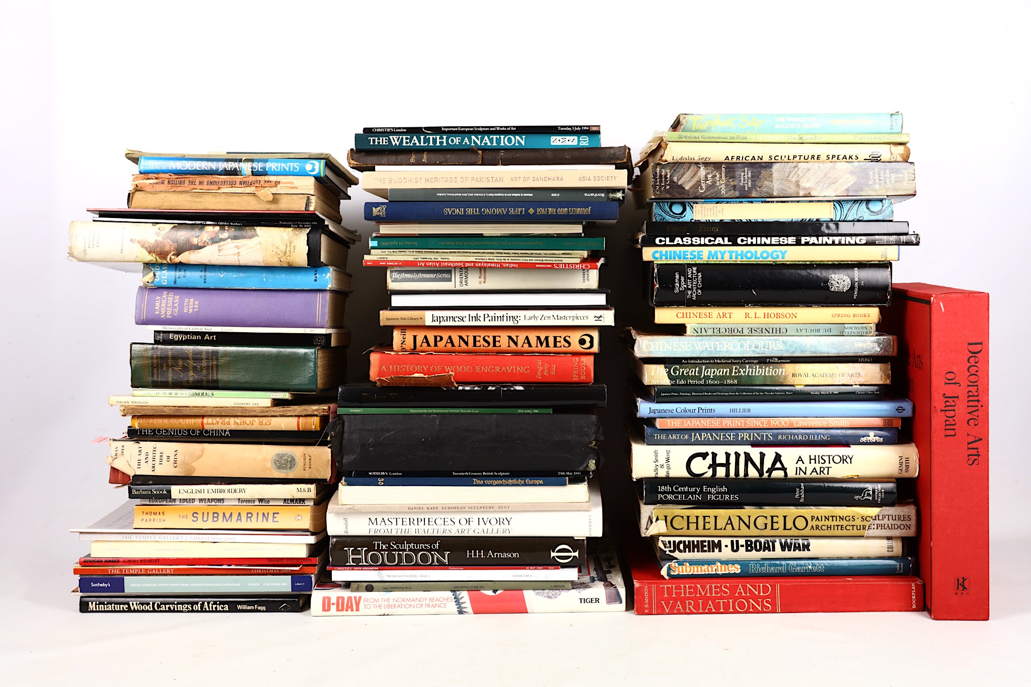 A varied collection of books and catalogues, including Chinese and Japanese art reference books