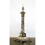 Early 20th century silvered metal lamp base the pierced spiral cast column on square base with lions