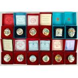 A collection of twelve cased Bilston enamel boxes, 20th Century, comprising a set of 9 Halcyon