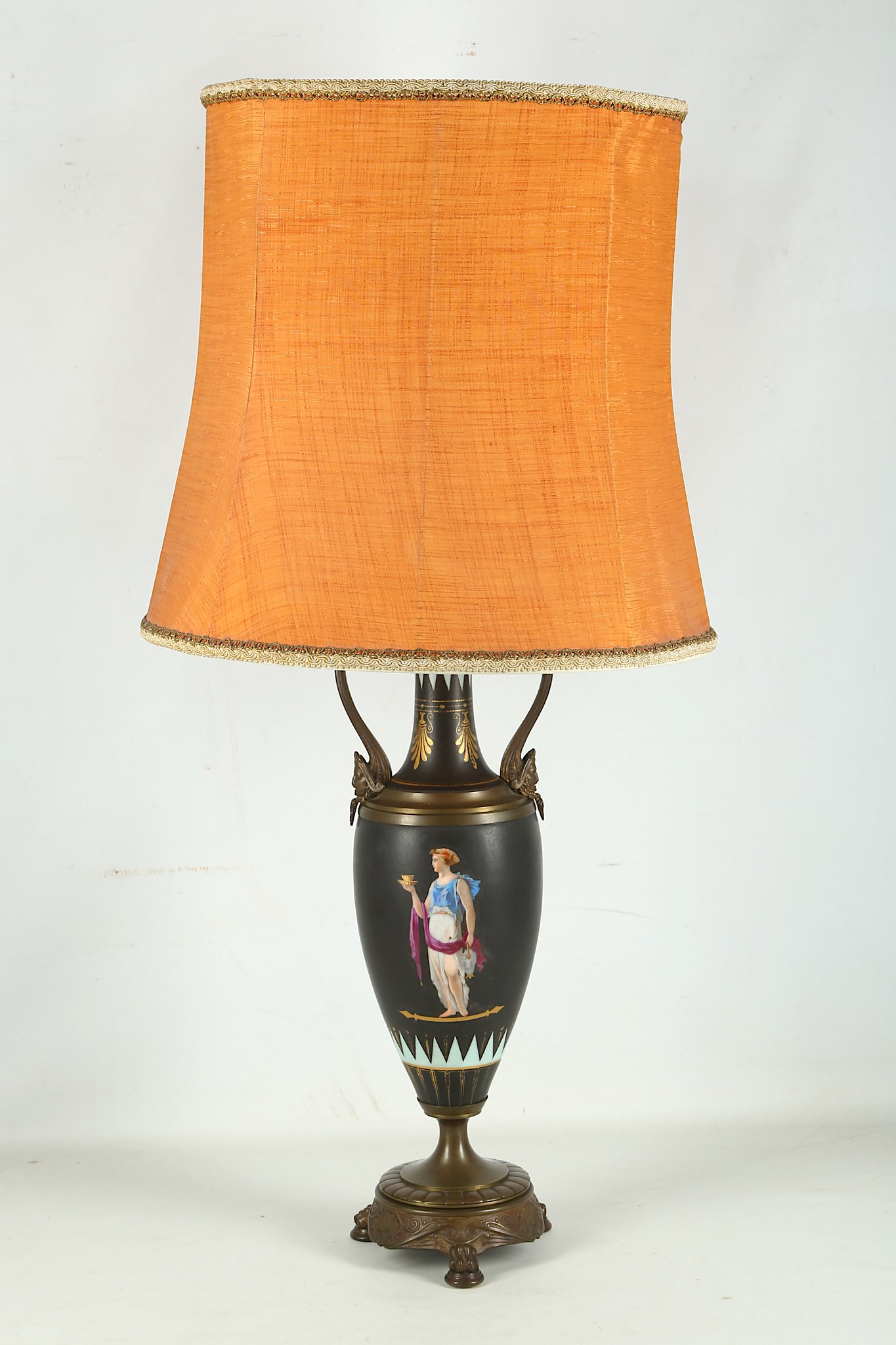 A Victorian gilt metal mounted porcelain lamp base, decorated with Anthemion's and Grecian