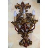 A pair of Florentine style carved giltwood wall sconces with pierced acanthus decoration and cast