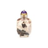 A crystal reverse painted snuff bottle with lid, early 20th Century, 7cm high.