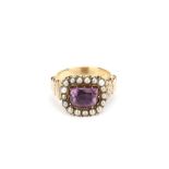 An amethyst and pearl ring, The mixed-cut amethyst in a foiled closed-back setting, within a