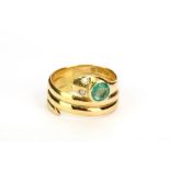 A 19th century snake ring with diamond eyes, later set with a circular-cut emerald, UK hallmark,