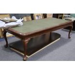 A large 1920's mahogany library table with faux leather top on cabriole legs, 274cm long.
