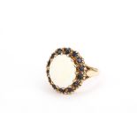 An opal and sapphire cluster ring, in 9ct gold mount, UK hallmark, ring size O