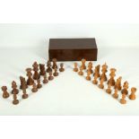 An early 20th Century George V period, boxwood and turned wood open-work chess set. In complete