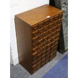 An early 20th Century oak office chest, fitted sixty small drawers, 49cm wide.