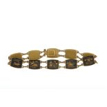 An early 20th century Shakudo style bracelet Composed of rounded rectangular plaques inlaid with