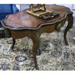 A 19th Century French ebonised boulle work centre table of shaped oval form, gilt metal mounted with