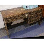 A Moorish hardwood kneehold desk, inlaid throughout with mother of pearl geometric decoration,