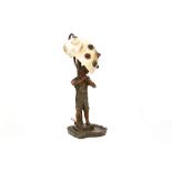 An early 20th Century Continental cold-painted bronze figural lamp base, cast as a peasant boy in