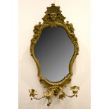 A late 18th / early 19th Century giltwood and gesso girandole, the cartouche frame with mask