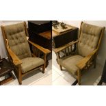 A pair of Arts & Crafts oak armchairs, in the manner of Gustav Stickley, the upholstered sliding